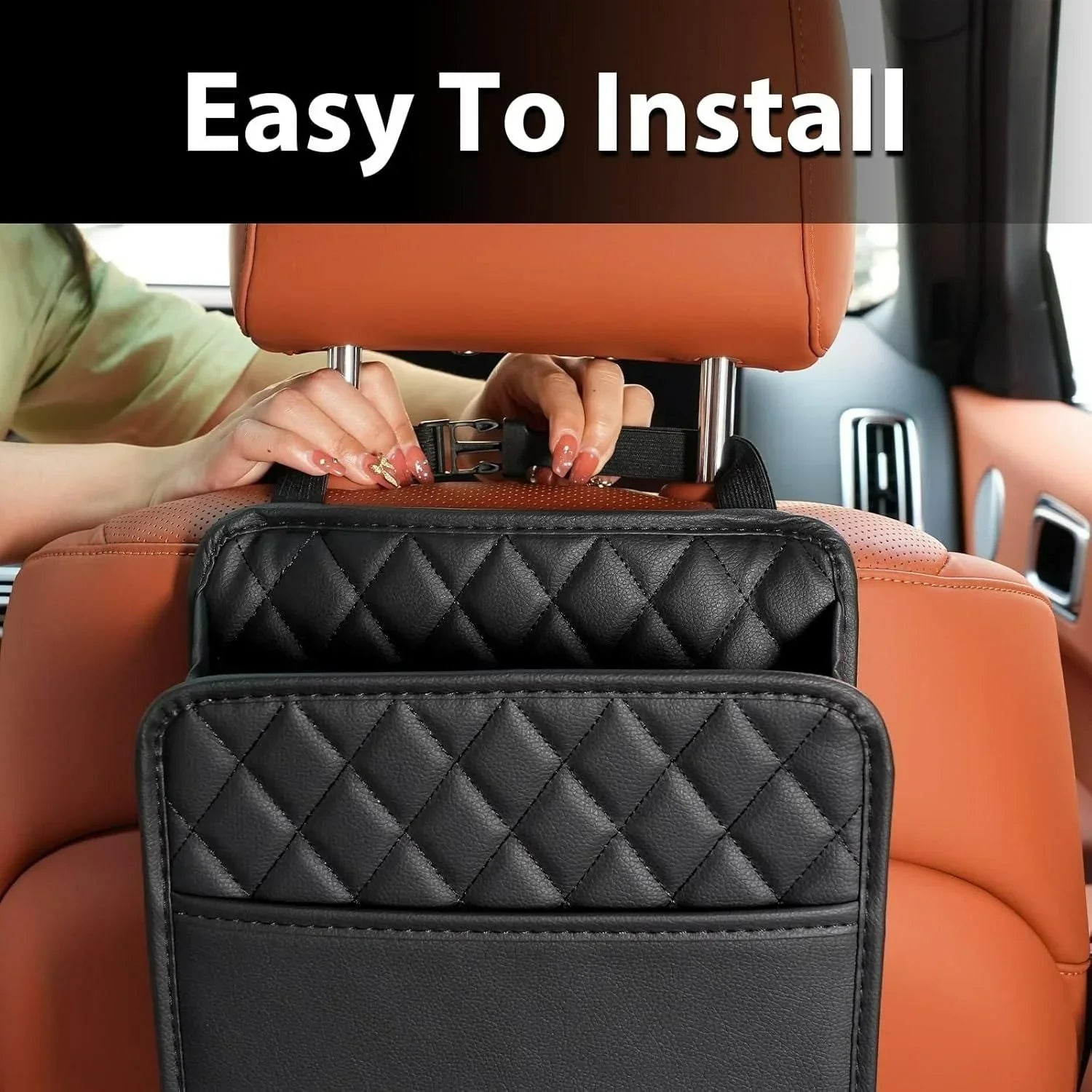 Black quilted car seat organizer being installed on tan leather car seat with easy-to-install strap