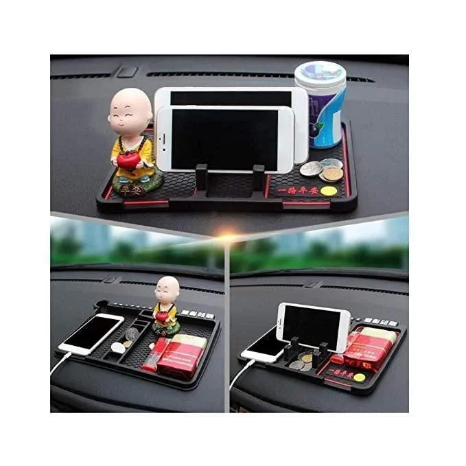 car dashboard organizer with monk figurine, phone holder, coins, and cup holder for car accessories